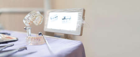 Example implant false teeth and monitor X-ray equipment in dental Clinicの写真素材