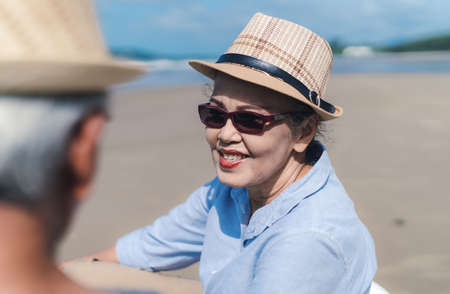 Asian couple senior elder retirement resting at beach honeymoon family together happiness people lifestyleの写真素材