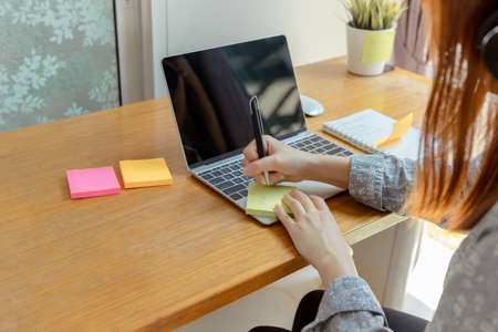 Close up woman working from home finish project, Prevent the spread of coronavirus quarantine for...