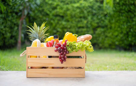 Food on wooden crate fresh healthy eating deliver at home from garden farm online shopping supermarket new nornal life.の写真素材