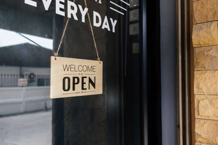 Welcome open sign front glass door store. Reopening business startup after coronavirus the lockdown,...