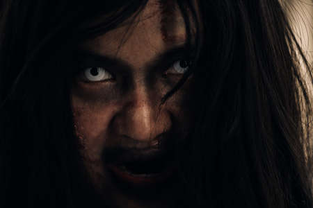 Close up face Horror of ghost woman death halloween festival in the dark house nightmare screaming