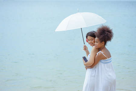 Ethnicity Happy Family Africans Enjoy relaxation resting on the beach summer vacation time happiness...