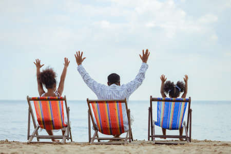 Ethnicity Happy Family Africans Enjoy relaxation resting on the beach summer vacation time happiness group people American outdoors nature.の写真素材