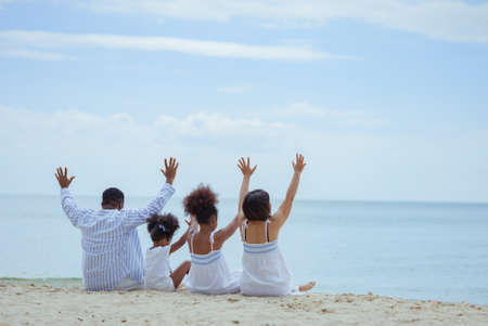Ethnicity Happy Family Africans Enjoy relaxation resting on the beach summer vacation time happiness group people American, Asian Slow motion footage outdoors nature.の写真素材