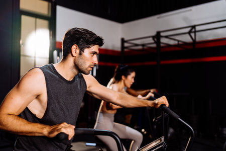 Athlete Sporty Group Cardio Exercise Burning Calorie in Fitness Gym Fit Body Healthy Lifestyle Athlete Muscle Building Strong Endurance in Health Club.の写真素材