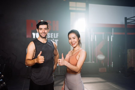 Portrait of Couple Smiling Exercise Workout in Gym Healthy Lifestyle bodybuilding, Athlete builder muscles lifestyle in Fitness club, Happy helth care mobility concept.の写真素材