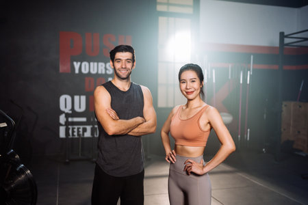 Portrait of Couple Smiling Exercise Workout in Gym Healthy Lifestyle bodybuilding, Athlete builder muscles lifestyle in Fitness club, Happy helth care mobility concept.の写真素材