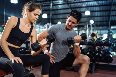 Coaching Woman Basic Workout Exercise in Fitness Gym Weight Training Healthy Lifestyle bodybuilding, Athlete doing Deadlift with barbell for builder muscles sportive.の写真素材