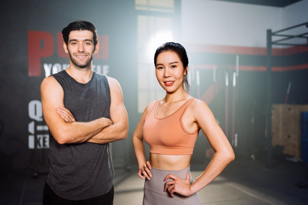 Portrait of Couple Smiling Exercise Workout in Gym Healthy Lifestyle bodybuilding, Athlete builder muscles lifestyle in Fitness club, Happy helth care mobility concept.の写真素材