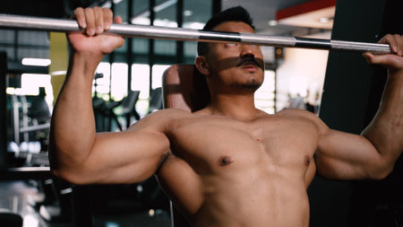 Sport Athlete man Workout Shoulder Press with barbell in Fitness gym Healthy Lifestyle bodybuilding, Active training builder muscles lifestyle.の写真素材