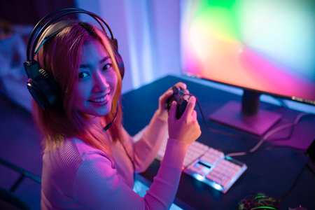 A Professional female pro gamer play online mobile games cyber sport and esport winner emotion....