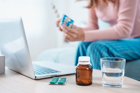 Asian woman patient talk to doctor on mobile phone online clinic videocall conference consult about eat pills on medical app, Telehealth telemedicine service hospital concept.の写真素材
