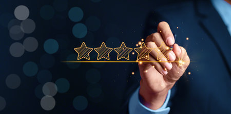 Businessman holding five stars for customer feedback and evaluation in experience service and product. Excellent rating. User give rating, good business network score.の写真素材