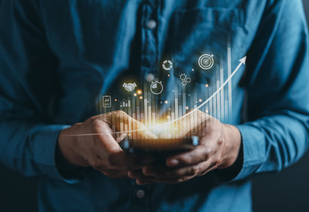 Businessman using mobile phone for analyzing forex trading graph financial data. Business finance technology and investment concept. Stock Market Investments Funds and Digital Assets. Business finance.の写真素材