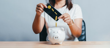 Banking and Saving money, Woman using mobile phone app for saving money or investment with online banking application technology. retirement planning and insurance concept.の写真素材