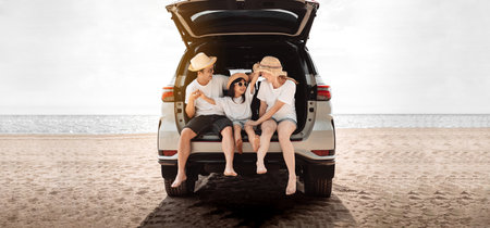 Family with Car travel driving road trip summer vacation in car in the sunset, Dad, mom and daughter happy traveling enjoy holidays and relaxation together get the atmosphere and go to destinationの写真素材