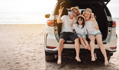 Family with Car travel driving road trip summer vacation in car in the sunset, Dad, mom and daughter happy traveling enjoy holidays and relaxation together get the atmosphere and go to destinationの写真素材