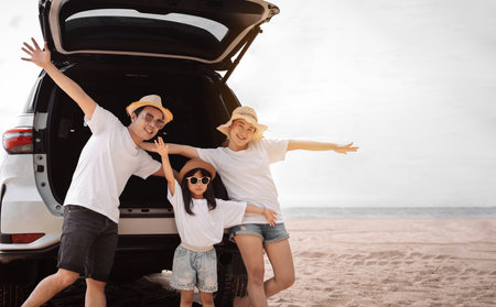 Family with Car travel driving road trip summer vacation in car in the sunset, Dad, mom and daughter happy traveling enjoy holidays and relaxation together get the atmosphere and go to destinationの写真素材