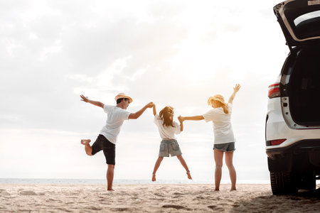 Family travel car road trip concept. summer vacation in car in the sunset, Dad, mom and daughter happy traveling enjoy and relaxation together driving in holidays, people,lifestyle with transportationの写真素材