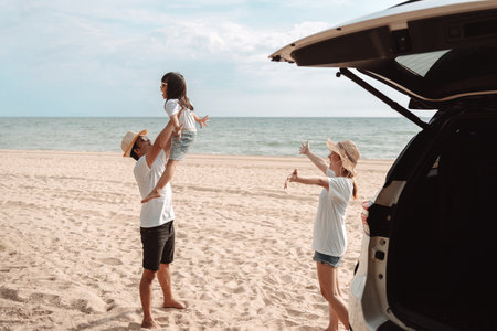 Happy Family with car travel road trip. summer vacation in car in the sunset, Dad, mom and daughter happy traveling enjoy together driving in holidays, people lifestyle ride by automobile.の写真素材