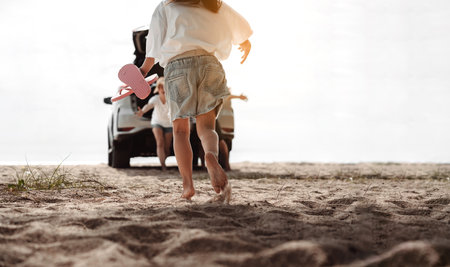 Family travel car road trip concept. summer vacation in car in the sunset, Dad, mom and daughter happy traveling enjoy and relaxation together driving in holidays, people,lifestyle with transportationの写真素材