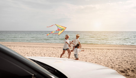 Happy Family with car travel road trip. summer vacation in car in the sunset, Dad, mom and daughter happy traveling enjoy together driving in holidays, people lifestyle ride by automobile.の写真素材