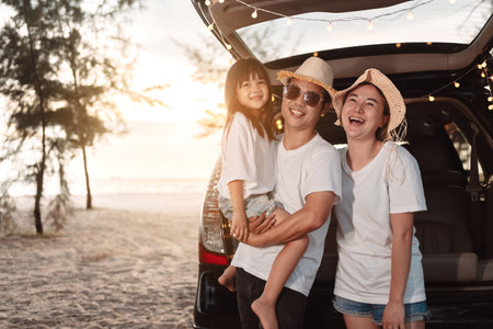 Happy Family with car travel and camping road trip. summer vacation in car in the sunset, Dad, mom and daughter happy traveling enjoy together driving in holidays, people lifestyle ride by automobile.の写真素材