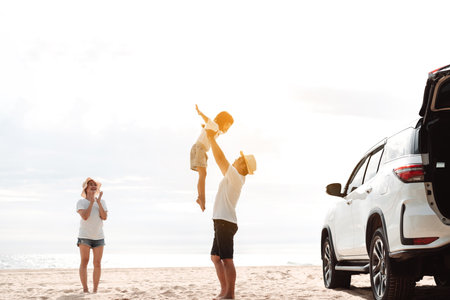 Family travel car road trip concept. summer vacation in car in the sunset, Dad, mom and daughter happy traveling enjoy and relaxation together driving in holidays, people,lifestyle with transportationの写真素材