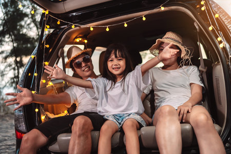 Happy Family with car travel and camping road trip. summer vacation in car in the sunset, Dad, mom and daughter happy traveling enjoy together driving in holidays, people lifestyle ride by automobile.の写真素材