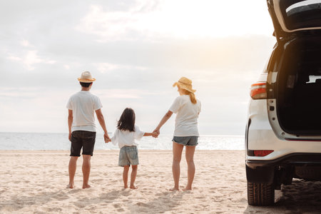Family travel car road trip concept. summer vacation in car in the sunset, Dad, mom and daughter happy traveling enjoy and relaxation together driving in holidays, people,lifestyle with transportationの写真素材