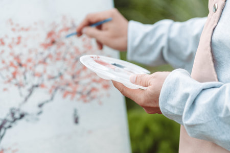 Asian caregiver helping senior male from falling on the ground. Older elderly man patient having accident heart attack when physical therapy. Nurse assistance rescue concept.の写真素材