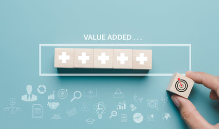 Business hand picking target value added download progress and profit to benefit growth and development in businessの写真素材