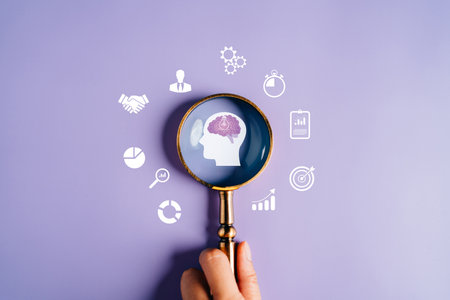 Magnifying glass focus to human brain with light bulb icon which for mind, creative, idea, innovation, motivation planning development leadership and customer target group concept.の写真素材