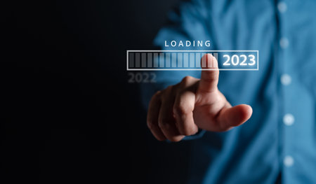 Businessman touching to virtual download bar and loading for New Year and changing year 2022 to 2023. start up planing business in next years concept.の写真素材