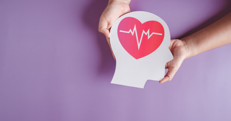 hands holding paper brain and red heart pulse, brain stroke, world heart day, world mental health day, Alzheimer and wellness conceptの写真素材