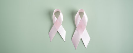Pink ribbons on colored background, Breast cancer awareness, world cancer day, national cancer survivor day in february concept.の写真素材