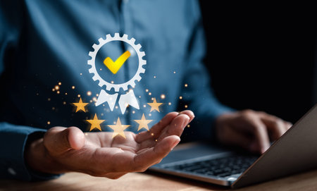Hand shows the sign of the top service Quality assurance, Guarantee, Standards, ISO certification and standardization concept. best quality of product and service.の写真素材