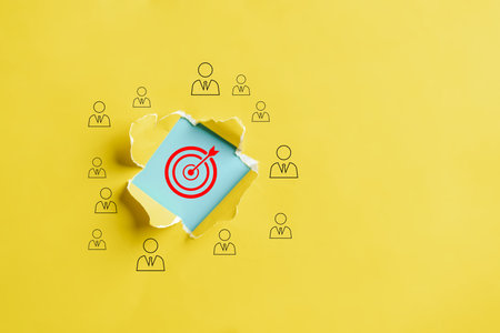 Dartboard with arrow hiding of yellow punched paper, business people target for planning business...