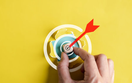 Dartboard with arrow hiding of yellow punched paper, businessman target for planning business...