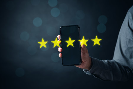 Customer Experiences of man give review score, Client Satisfaction Surveys on smartphone feedback review concept. Customer service experience and business satisfaction.の写真素材