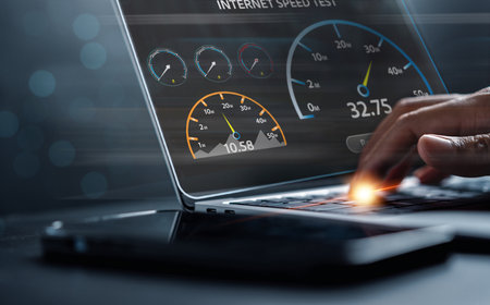 Super Fast internet connection speedtest bandwidth network technology, Man using Internet high speed by smartphone and laptop computer, 5G quality, speed optimization.の写真素材