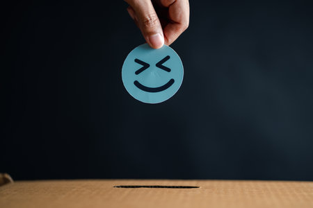 Hand giving happy smile face in comment box, user giving good feedback rating, think positive , customer review, assessment, of mental health day, Compliment Day, satisfaction concept.の素材 [FY310197769687]