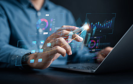 Analyst working with computer in Business Analytics and Data Management System to make report with...