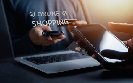 Shopping online payment concept. Man hand using computer for  banking and online shopping via banking mobile app, E-transaction and financial technology.の写真素材