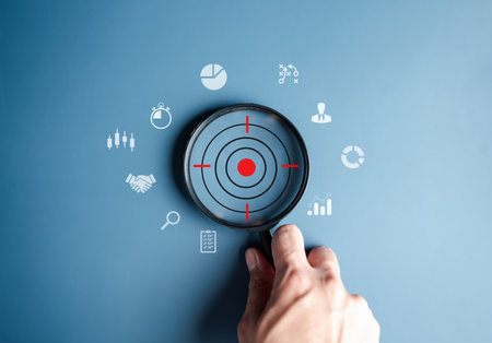 Magnifier glass focus to target icon which for planning development leadership and customer target group concept.の写真素材