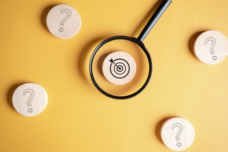 Magnifier focus to target solution target which among question icon, successful business and thinking solution strategy concept.の写真素材