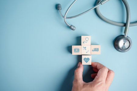 Health insurance concept. people hands putting plus symbol and healthcare medical wooden cube block with stethoscope, health and access to welfare health.の写真素材