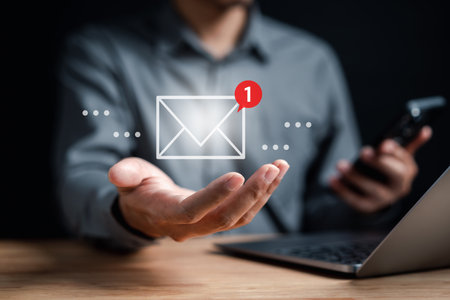 Businessman reading new email by laptop computer to customer, business contact and communication, email icon, email marketing concept, send e-mail or newsletter, online working internet network.の写真素材