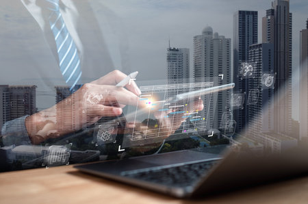 Analyst working with computer in Business Analytics and Data Management System to make report with KPI and metrics connected to database. Corporate strategy for finance, operations, sales, marketing.の写真素材